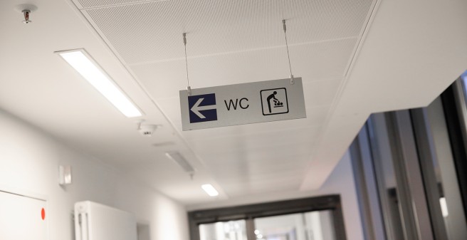 restroom direction sign